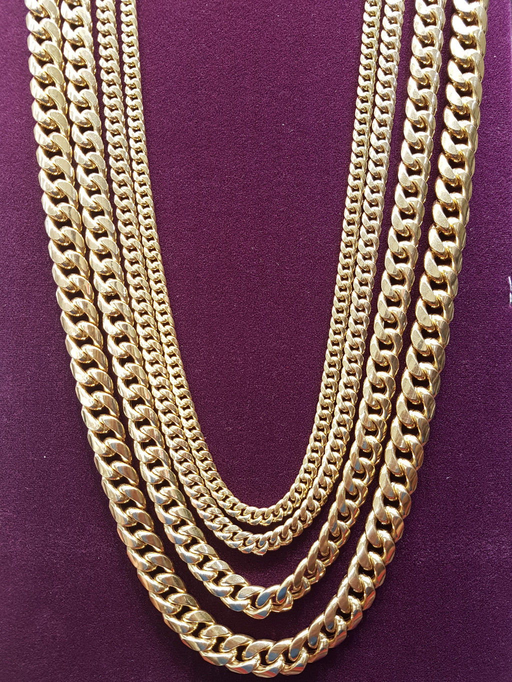 Gold plated link chain necklace with heart shaped lock and evil