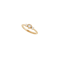 Diagonal view of a 14k rose gold Bezel-Set Heart Diamond Three Stone Ring
